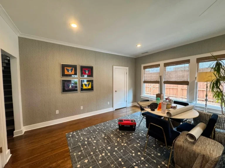 Grasscloth wallpaper covering the full walls of a furnished Denver living room after installation
