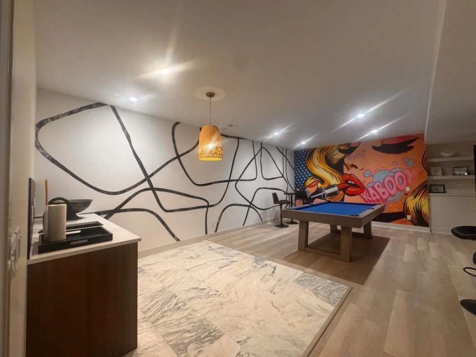Abstract black line mural wallpaper in a Denver game room with a pool table and bar area